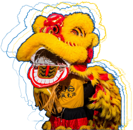 Photo of a yellow and red colored Chinese lion head.